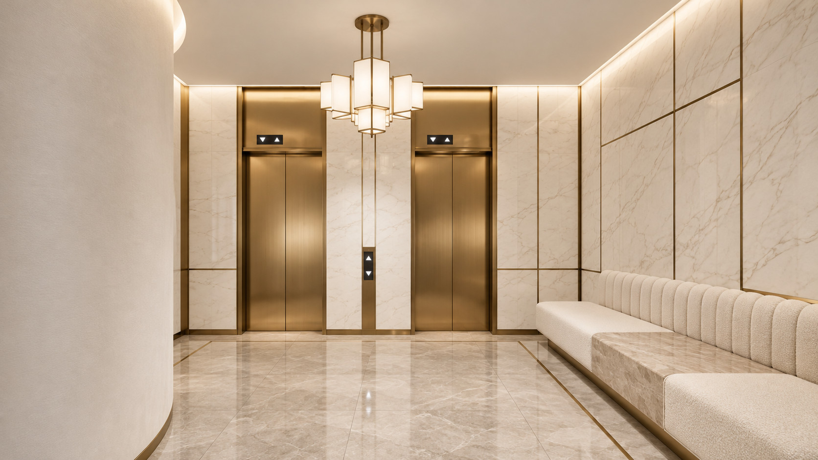 The residential lobby, with twin brass lift doors in pale marble, a tiered lantern pendant and a long upholstered bench.